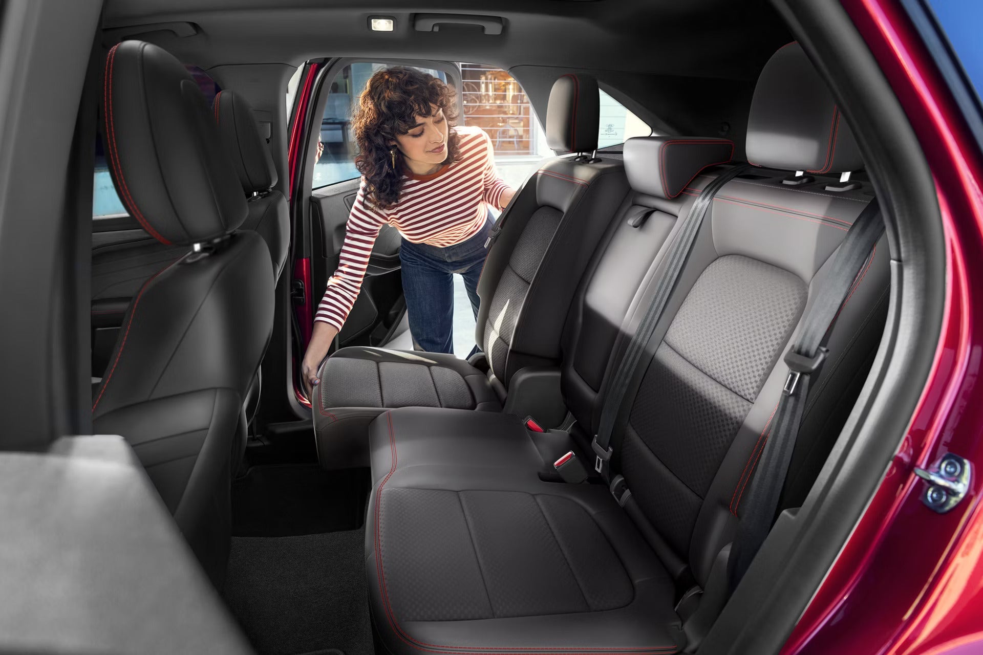 2026 Ford Escape view of a lady moving the back seat.