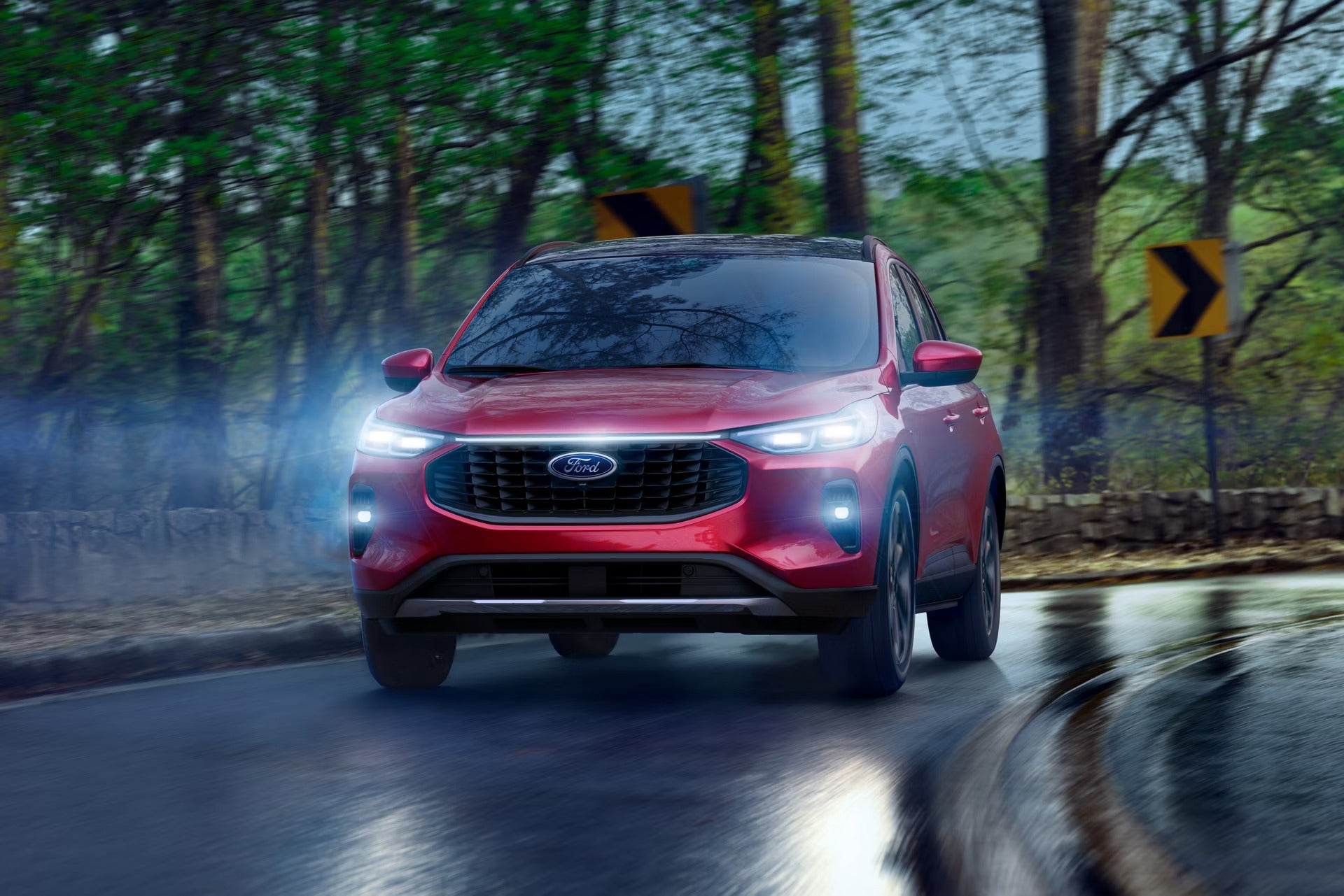 2026 Ford Escape driving on a road in the rain