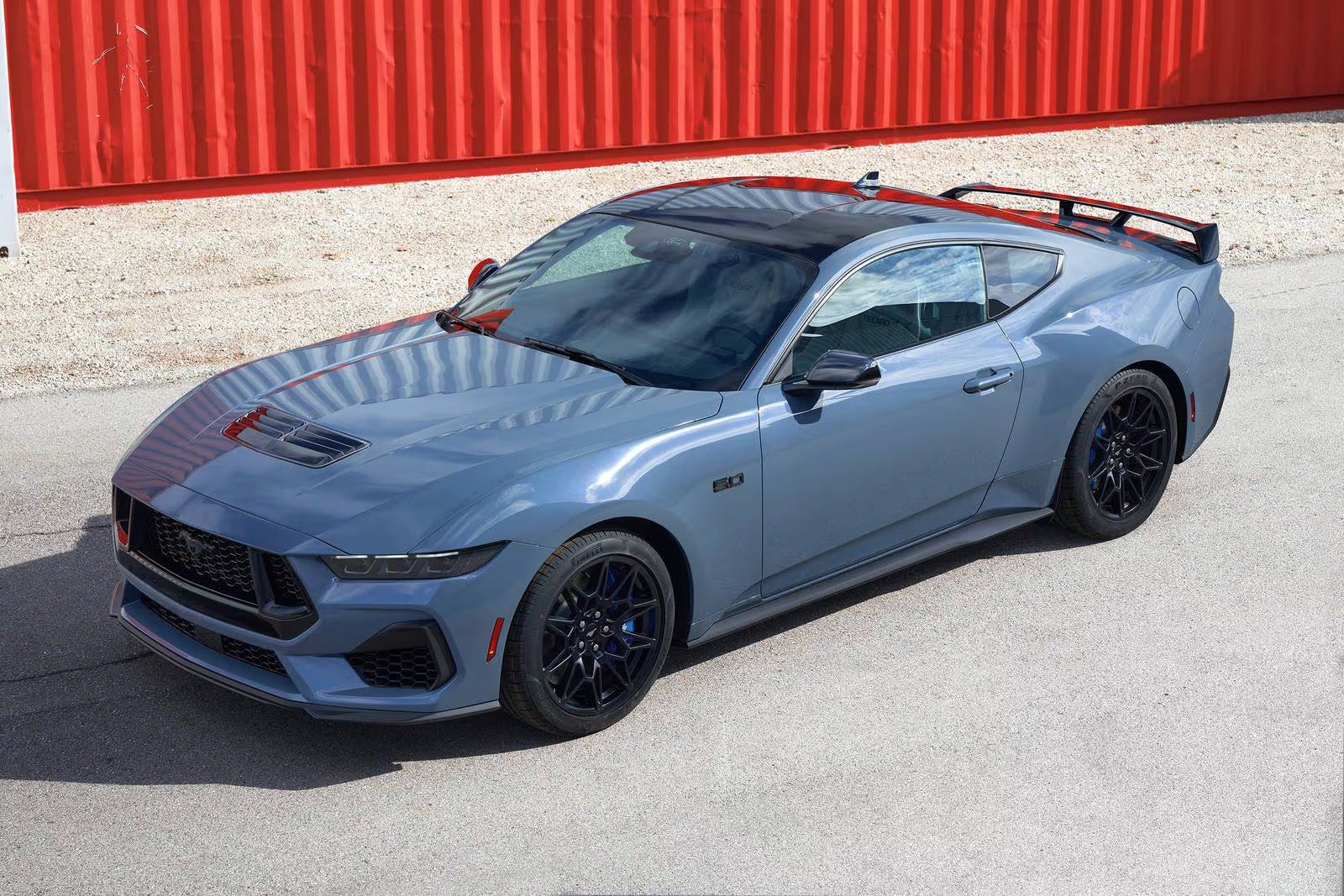 light blue 2026 ford mustang parked in a parking lot